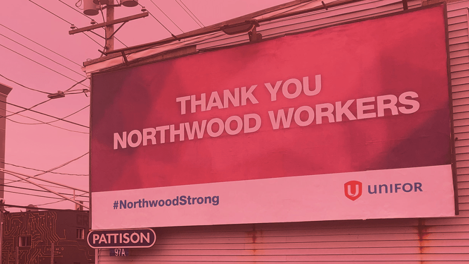 A billboard supporting Unifor members working at Northwood Long Term Care Home seen on a Halifax street. The image has a red colour wash on it.