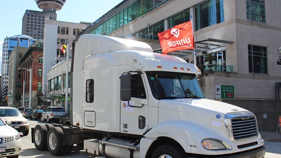 White Semi Truck with a Unifor Flag